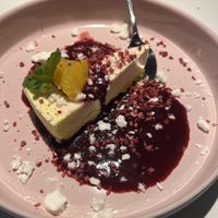 Ice cold orange cake with blackcurrant sauce and meringue   at Vegan Restoran V in Tallinn