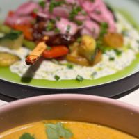 BBQ soy skewer with fried early potatoes, vegetables and mint tzatziki sauce at Vegan Restoran V in Tallinn