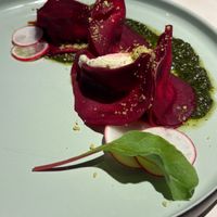 Beetroot ravioli with cashew cream sheese and basil pesto at Vegan Restoran V in Tallinn