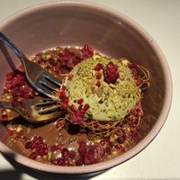 September 2025 - Dubai dessert with pistachio cream ball, crispy kataifi, nougat sauce and raspberries at Vegan Restoran V in Tallinn