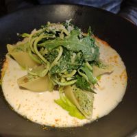 Pasta filled w/ spinach/ vegan cream cheese in white wine sauce + zucchini stripes at Vegan Restoran V in Tallinn