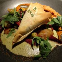 Special of the day: chanterelle mushroom filo pie on roasted vegetables and a moreish sun-dried tomato hummus. at Vegan Restoran V in Tallinn