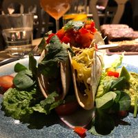 Spicy oven-baked seitan tacos with cheese, guacamole and mango salsa  at Vegan Restoran V in Tallinn