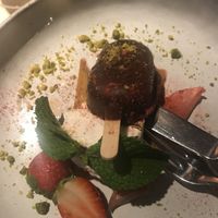 Strawberry cheese cake with marshmallow thingi, sparkling wine marinated rhubarb and pistachios! at Vegan Restoran V in Tallinn