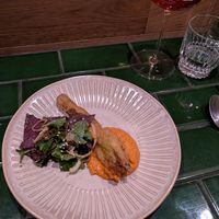 Half serve almond ricotta stuffed zucchini flower red pepper romesco at HUMBUG in Newcastle