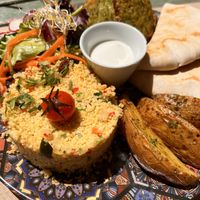 Dish of the day: Falafel (they were awesome), tabouleh, salad, potato wedges, vegan yoghurt sauce. 😋   at Temple Natura in Mallorca