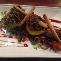 Quinoa/frield mushroom filled peppers with stir-fried wombok/red cabbage/chilli/snow peas and wilted baby spinach and teriyaki glaze. at Vivo Bar and Grill in Palm Cove
