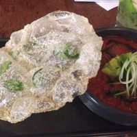 Tomato/avocado gazpacho with cucumber vermicelli and crunchy basil rice paper and herb oil at Vivo Bar and Grill in Palm Cove