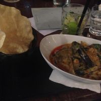 Green chickpea curry with chargrilled zucchini/eggplant and crisp pappadams. at Vivo Bar and Grill in Palm Cove