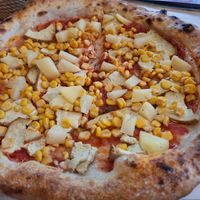 Vegan pizza with tofu, green pea protein, corn, pineapple. at Pelso di Napoli in Balatonlelle