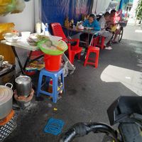 Seating outside behind the stall on the street at Quán Chay Kinh Moi in Ho Chi Minh City