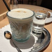 Iced Cappuccino oat milk 4,80€ (served with non vegan biscuit)  at Cafe Stern in Linz
