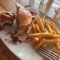 Half eaten vegan chicken sandwich   at Tiny's Coffee Bar in Gary