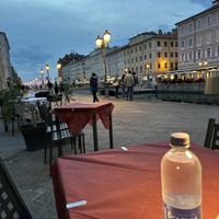 View of canal and sunset from our seat  at Tang Ramen in Trieste
