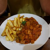 Seitan stew with fries at Kozmosz Vegan Etterem in Budapest