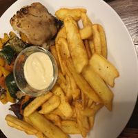 Oven-baked veggie plate with fries and garlic sauce  at Kozmosz Vegan Etterem in Budapest