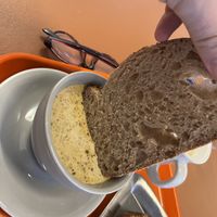 Dipping the bread in soup  at Daily Lucky 데일리럭키 in Busan