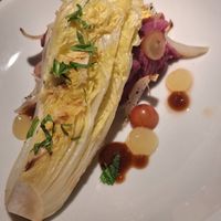Roasted chinese cabbage with purple mashed potato and some kind of sweet and tangy sauce. at Vaust Bar & Restaurant in Berlin