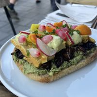 Delicious Focaccia with marinated portabello mushrooms, cashew based creamy sauce and pickled onions.  at SKØG Urban Hub in Brno
