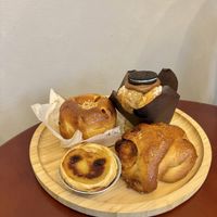 A selection of pastries. Chocolate cruffin, pumpkin bun, peanut bun and pastel de nata  at Moko Vegan Bakery in Lisbon
