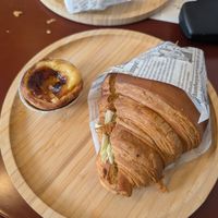 Vegan chicken and cabbage croissant, and custard tart at Moko Vegan Bakery in Lisbon