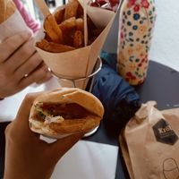 Vegan hot dog and portion of french fries at Al Fred in Tirol