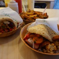 Falafel with marinated cauliflower, radish, tomatoes, fresh herbs, red beet, carrot and some more chickpeas. And of course another squeeze of tahini!
Pick whatever you like or keep it simple, whatever you prefer :)  at Falafel Tof in Antwerpen
