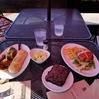 Poppin’ Jalapeño Burger
Two made-with-plants burger patties covered in melted Follow Your Heart® American cheese and topped with pickled jalapeños and made with plants jalapeño, pimento cheese. Served on a toasted pretzel bun with romaine lettuce, green goddess dressing, and crispy shallots. 
and
Meatball Sub
Spicy seitan meatballs, marinara, caramelized
onions, roasted red peppers, pumpkin seed
pesto, creamy ranch and parmesan. Served on
toasted baguette.  at Native Foods - Point Loma in San Diego