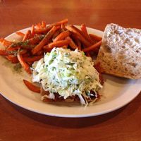 BBQ Brisket Ciabatta! the sandwich absolutely delicious! very messy; juices drippin everywhere! cole slaw was piled on high had to eat some with a fork so that I could eat the sandwich! cole slaw should be added to the sides menu! at Native Foods - Point Loma in San Diego