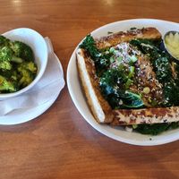 Sesame kale bowl with sauerkraut and tempeh with lemongrass broccolli on side. One of my favourite dishes at Native Foods - Point Loma in San Diego