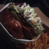 BBQ burger to go - look at all that slaw! at Native Foods - Point Loma in San Diego