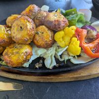 Achari Mushroom Tikka: grilled spicy mushrooms from the tandoor  at DesiLicious Tandoor & Bar Dreieich in Dreieich