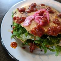 The Gordita is awesome! Ask no cheese or crema, sub cauliflower chorizo, add extra pickled red onions and hot sauce! at Fuego Tacos & Mezcal in Winchester