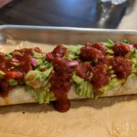 Cauliflower chorizo burrito with no cheese, rice, beans, added guac, pickled red onions, and hot sauce!  at Fuego Tacos & Mezcal in Winchester