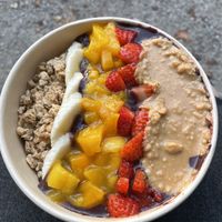 Acai bowl with mango, strawberries and peanut butter  at Daddy Longlegs in Munich