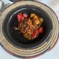 Lentils with deep fried plantains and fruit  at Yaya's Kitchen in London