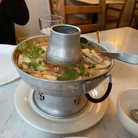 Tom kha soup. You can’t see it in the photo, but there’s a gentle flame shooting up the center to keep the soup warm    at Araya's Place - Madison St in Seattle