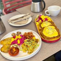 Breakfast plate and eggs benedict at Tranzit by Flow in Budapest