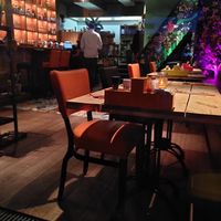 Indoor sitting area and bar, also more space upstairs at El Rey in Woerden