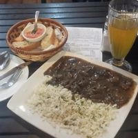 Champignones al jerez con arroz al perejil. at Soju in Santiago