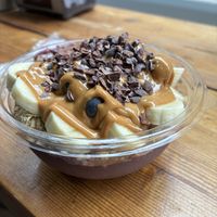 Peanut butter açaí with granola, dark chocolate nibs and fruit  at Chelsea Acai Cafe  in New York City