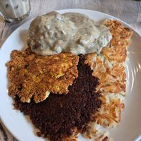 The Blue Plate Special is so delicious! Tofu scrambled, vegetarian sausage, hash browns, biscuits with mushroom gravy. at Off The Griddle - Northeast  in Portland