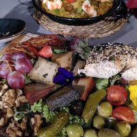 Tres amigos cheese platter and shrimp paella at Bubita Bar in Barcelona