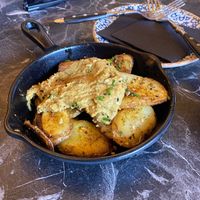 Potatoes with a mild curry sauce   at Bubita Bar in Barcelona