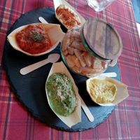 Selection of hummus, pesto, olives' paté... at Bubita Bar in Barcelona