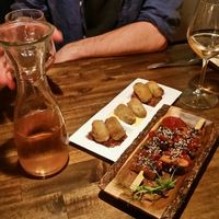 Tasty tempeh and croquetas on a paper dish at Bubita Bar in Barcelona