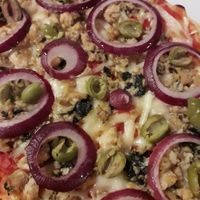 Pizza with veg tuna, onions and olives at Veganda in Padua