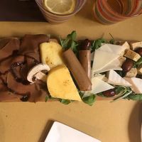 Mix of vegan cheeses, polenta and affettato at Veganda in Padua