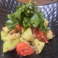 Green salad with quinoa, avocado, tomato and cucumber  at Cafe De Bobo in Dushanbe
