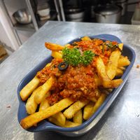 Their “Vegan Bolognese Fries”! Literally spaghetti sauce over French fries but they’re sooooooooo good! Made with their brand’s special plant-based protein| at Miss Green - Dunhua in Taipei